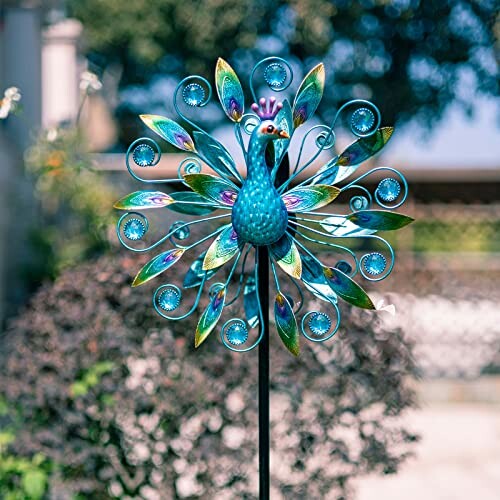 Colorful peacock garden wind spinner with decorative feathers.