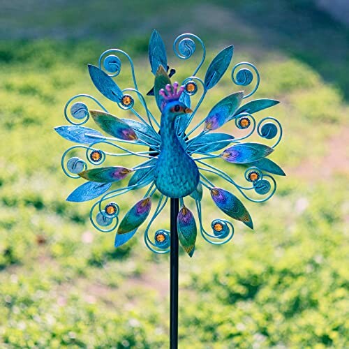 Colorful peacock garden wind spinner with vibrant feathers